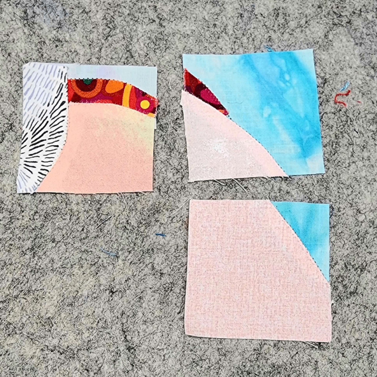 Quilt pieces being assembled with blue fabric