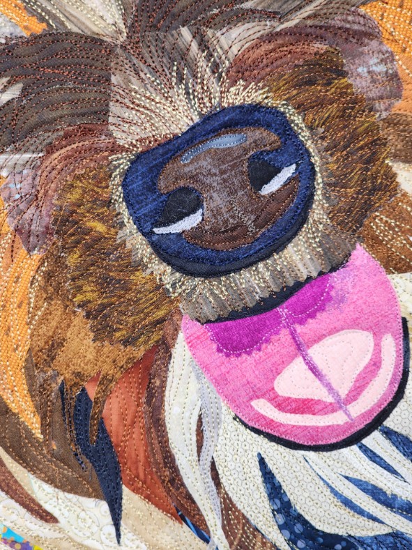 Close-up of Spyger's stitched nose and pink tongue