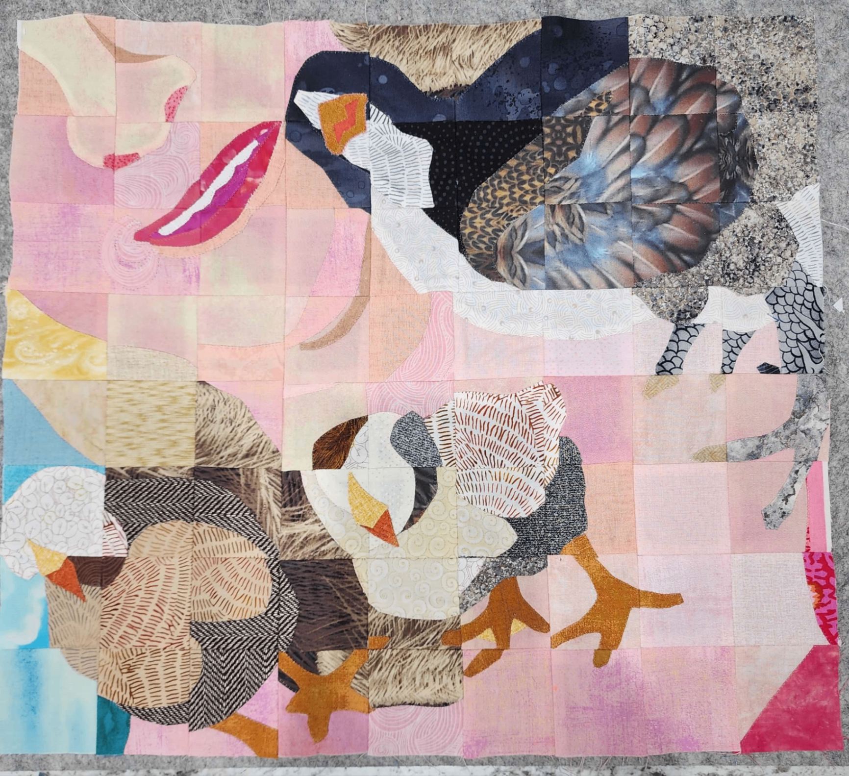 A quilted artwork featuring chickens